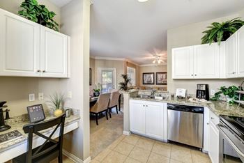 Pantry a dining room with white cabinets at The Missions at Rio Vista, 92108